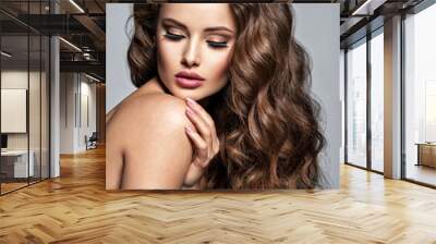 Face of a beautiful  woman with long brown  hair Wall mural