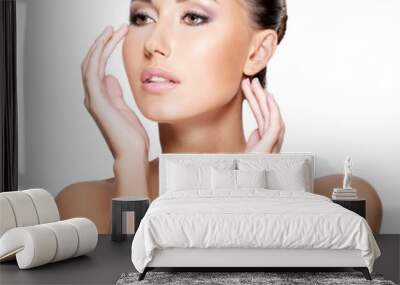 Face of a beautiful young woman with healthy skin Wall mural