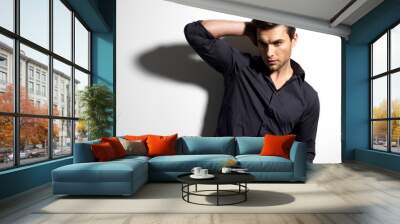 fashion portrait of young man in black shirt Wall mural