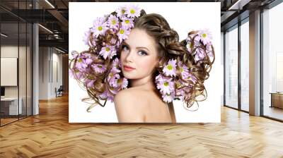 Flowers in long hair of beautiful and sexy woman Wall mural