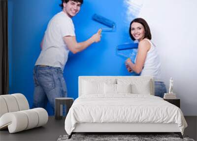 happy couple near the painted wall Wall mural