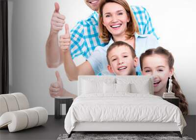 happy european family with children shows the thumbs up sign Wall mural