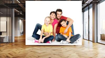 happy family with two children sitting on white floor Wall mural