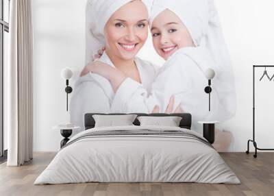 happy mother and young daughter in white dressing gown Wall mural