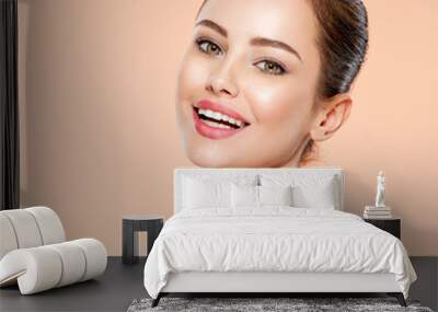 Portrait of smiling young woman with clean face. Close-up face with a smile of young adult woman with clean skin. Wall mural