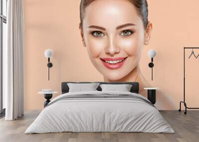 Portrait of smiling young woman with clean face. Close-up face with a smile of young adult woman with clean skin. Wall mural