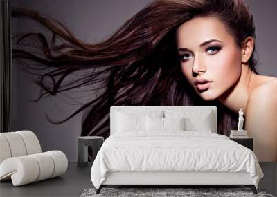 Portrait of the beautiful  young woman with long brown  hair Wall mural