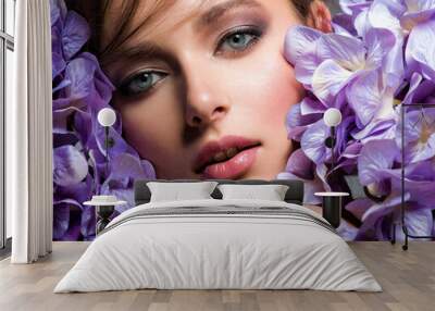 Pretty woman with bright makeup. Beautiful white girl with flowers. Stunning brunette girl with big bouquet  of hydrangeas. Closeup face of young beautiful woman with a healthy clean skin. Wall mural