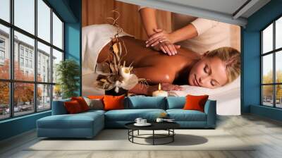 professional masseur doing massage of female back Wall mural