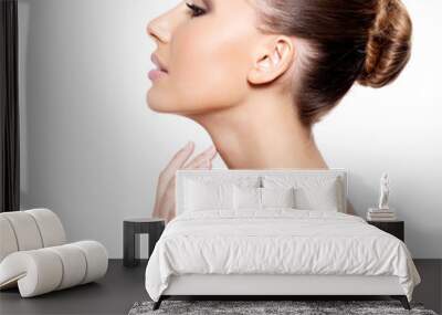 Profile of a beautiful woman with fresh clean skin Wall mural