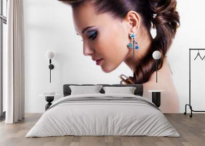 Profile  portrait of a beautiful woman with creative hairstyle Wall mural