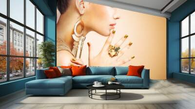 Profile portrait of the fashion woman with beautiful golden mani Wall mural