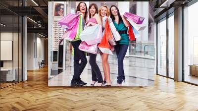 Women with shopping bags at shop Wall mural