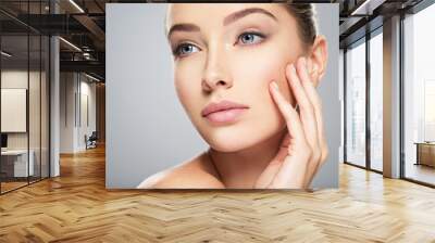 Young woman with beautiful face. Skin care Wall mural