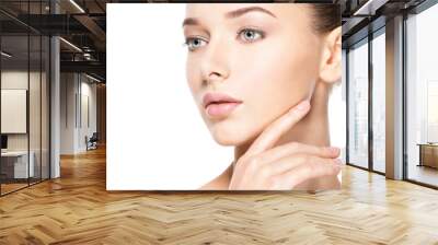 Young woman with healthy clean skin touches the face. Skin care concept. Wall mural