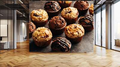 Different homemade muffins, selective focus. Wall mural