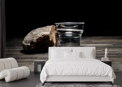 bread with water on a dark background Wall mural