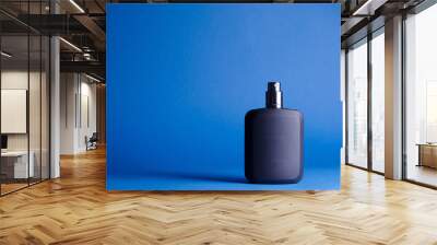 perfumes on a blue background Wall mural