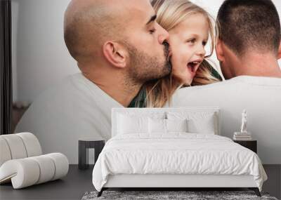 Gay male parents having tender moment kissing their son outdoor - Main focus on right father neck - LGBT and love family concept Wall mural