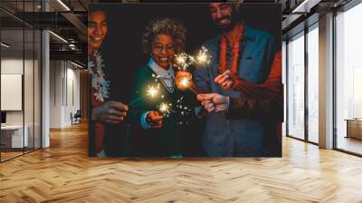 Happy diverse friends celebrating with sparklers on new year eve - Soft focus on african woman face Wall mural