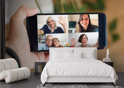 Multigeneration video call with parents and daughters talking on virtual conference at home during coronavirus lockdown - Social distance concept Wall mural