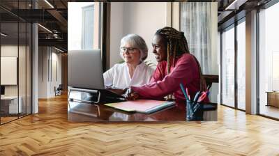 Multiracial senior and young business people with working inside modern office - Focus on old woman face Wall mural