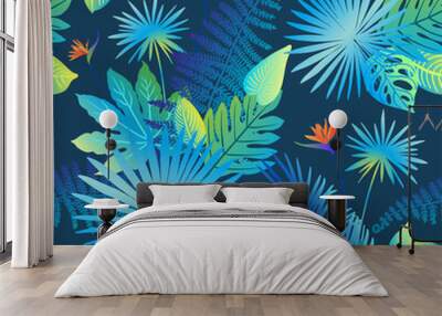 Pattern vector neon tropical leaves of palm, monstera, fern. Orange, purple and green plants on a blue background. Wall mural