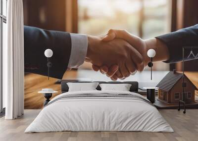 legant close-up handshake between a professional real estate agent and a client with a house model, contract, and keys on the table.real estate closing handshake,successful property deal Wall mural