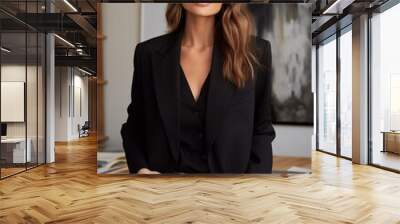 business woman in blazer and jeans portrait in home office standing in front of modern desk and bookcase Wall mural