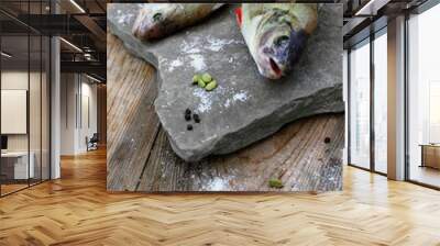 Two freshly cathing perch(bass) laying on the stone plate decora Wall mural