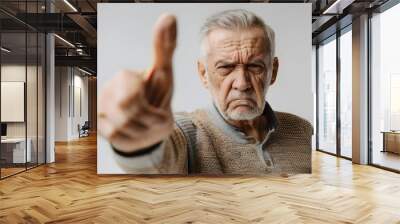 Annoyed Elderly Man Making Disapproving Hand Gesture on White Background with Natural Lighting Suitable for Healthcare Website Wall mural