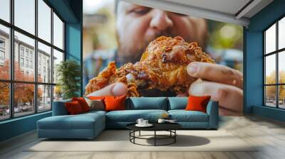 Overweight Man Indulging in a Large Piece of Fried Chicken with Blurred Background and Copy Space Wall mural