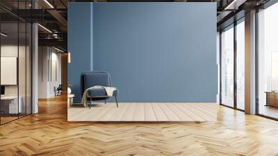 Empty living room with blue armchair and table on empty dark blue wall background. Wall mural