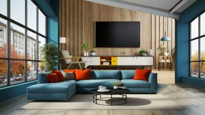 TV on cabinet in modern living room with lamp,table,flower and plant on wooden wall background. Wall mural