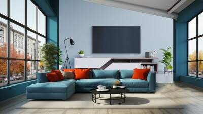 TV on the cabinet in modern living room on blue wall background. Wall mural