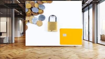 several Brazilian coins, a padlock and a orange credit card Wall mural