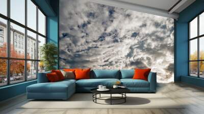 White clouds on dramatic blue sky as cloudy background Wall mural