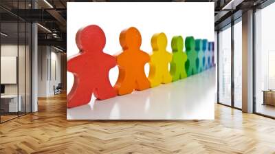 Brightly colored wooden people isolated on a white background. Wall mural