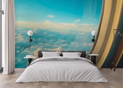 Beautiful view of fluffy clouds beneath a clear blue sky from an airplane window during daytime travel. Wall mural