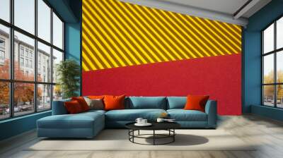 Background consisting of two parts : yellow corrugated surface and red. High quality photo Wall mural