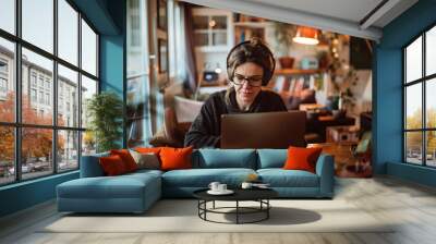 Businesswoman working at a desktop computer on a video call with colleague at home office decor Wall mural