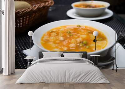 Potaje Canario,  delicious vegetable soup of Canary Island and popular dish at the menu of Guanchiche - local authentic restaurant. Lifestyle image. Wall mural