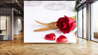 Red rose , gold cutlery and two red heart ion white background. Saint valentines day celebration or romantic dinner concept.Close up Wall mural