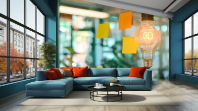 Two illuminated light bulbs are reflected on a glass wall covered with colorful sticky notes, symbolizing ideas and brainstorming in a creative and innovative environment. Wall mural