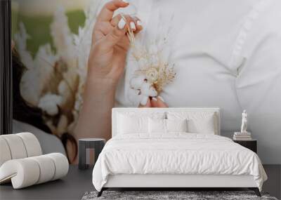 A man and woman are holding a white flower on the man's chest Wall mural