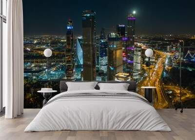 Night aerial cityscape with the view on skyscrapers and full moon Wall mural