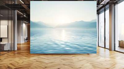 sunrise over the sea. A blue lake and blue mountains in the sun. The radiance of the sun on the background of water and mountains. Wall mural