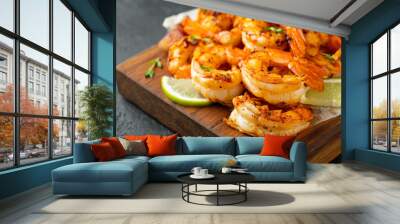 Grilled shrimps or prawns served with lime, garlic and white sauce on a dark concrete background. Seafood Wall mural