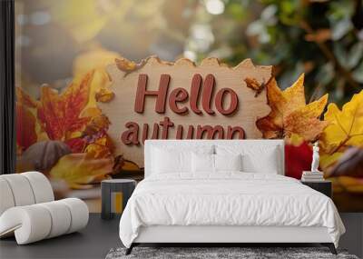 Hello Autumn white chalk lettering on blackboard. Autumn seasonal flat lay photo on wooden background. Hello Autumn inscription with orange leaf frame. Fall season banner template. Yellow leaf texture Wall mural