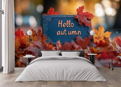 Hello Autumn white chalk lettering on blackboard. Autumn seasonal flat lay photo on wooden background. Hello Autumn inscription with orange leaf frame. Fall season banner template. Yellow leaf texture Wall mural